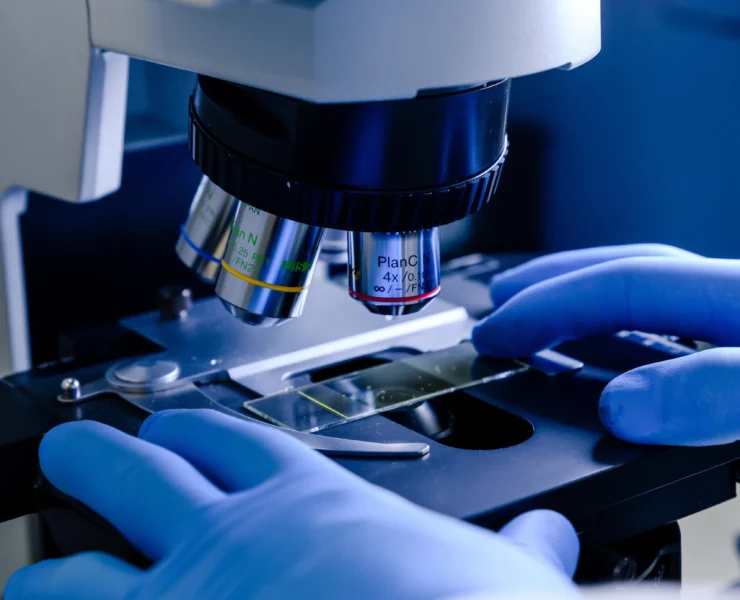 laboratory-worker-working-with-modern-microscope-while-conducting-coronavirus-research copy